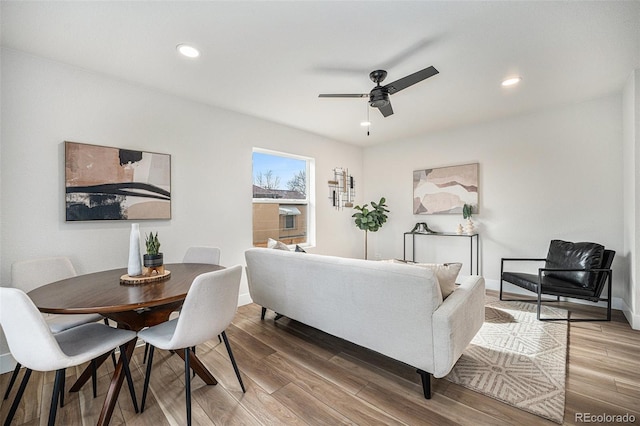 living room with hardwood / wood-style floors and ceiling fan