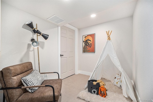 sitting room with light colored carpet