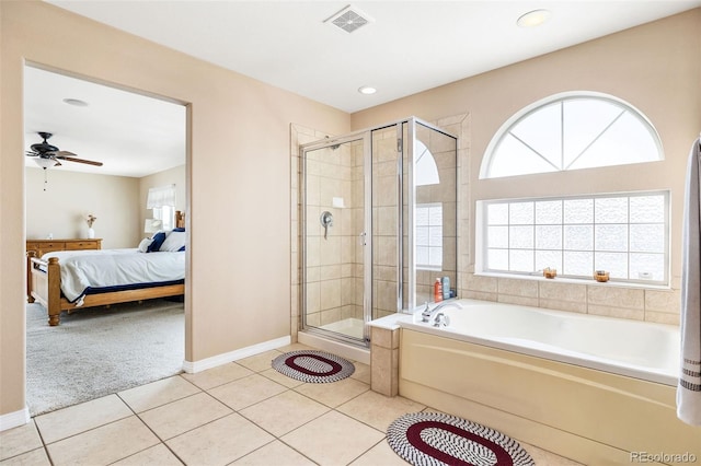 bathroom with ceiling fan, a wealth of natural light, tile patterned floors, and separate shower and tub