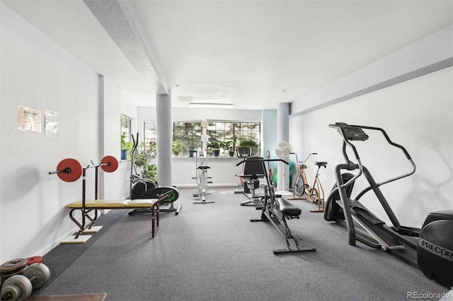 exercise room featuring a textured ceiling