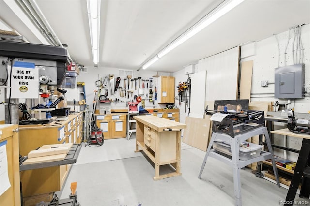 interior space featuring a workshop area and electric panel