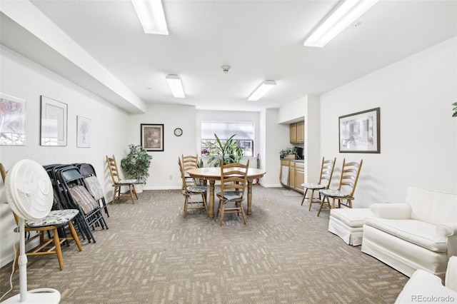 view of carpeted dining area