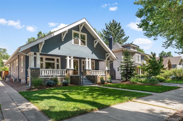 craftsman-style home featuring a porch and a front lawn