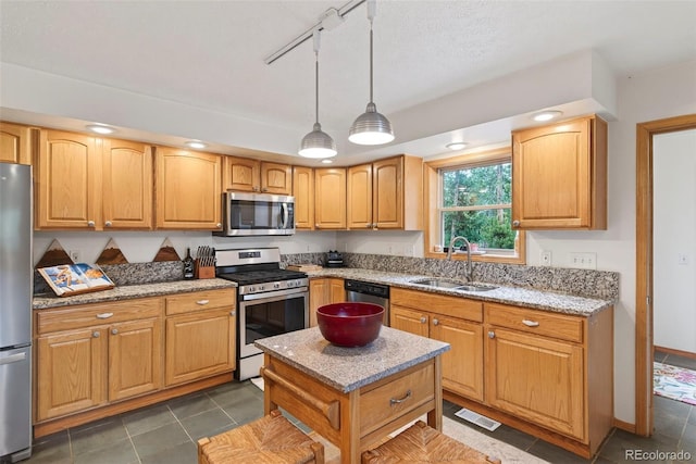 100 Moon Gulch Rd, Rollinsville, CO 80422 - kitchen with appliances with stainless steel finishes, light stone countertops, pendant lighting, dark tile patterned flooring, and recessed lighting
