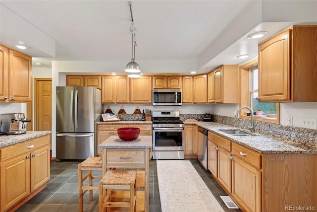 100 Moon Gulch Rd, Rollinsville, CO 80422 - kitchen with appliances with stainless steel finishes, light stone counters, pendant lighting, a center island, and recessed lighting