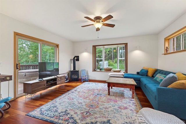 100 Moon Gulch Rd, Rollinsville, CO 80422 - living area with a wood stove, ceiling fan, and wood finished floors