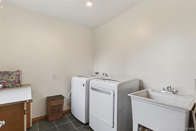 100 Moon Gulch Rd, Rollinsville, CO 80422 - washroom with washer and clothes dryer and dark tile patterned floors