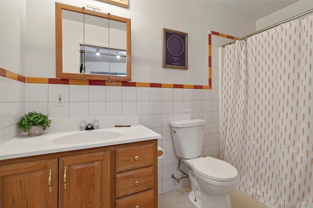 100 Moon Gulch Rd, Rollinsville, CO 80422 - bathroom with vanity, tile walls, a shower with curtain, tile patterned floors, and wainscoting