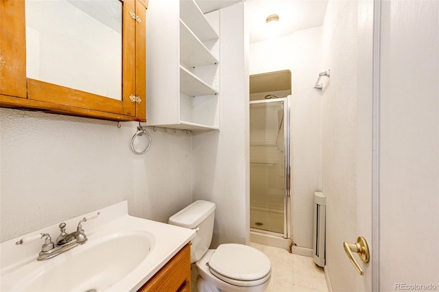 full bath with a stall shower, vanity, and toilet