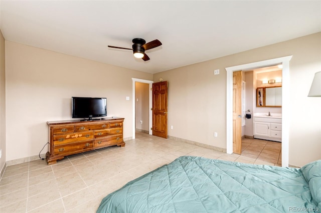 bedroom featuring light tile patterned flooring, baseboards, a sink, and a ceiling fan