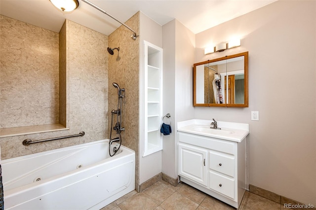 full bath with vanity, tile patterned flooring, a combined bath / shower with jetted tub, and baseboards
