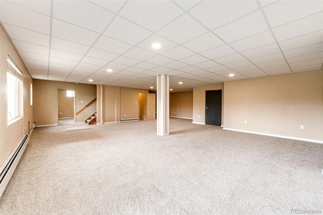 below grade area featuring a baseboard radiator, light colored carpet, stairway, a baseboard heating unit, and recessed lighting