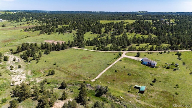 38879 Rusty Spur Trl, Agate, CO 80101 - aerial view of property and surrounding area featuring rural landscape and a heavily wooded area