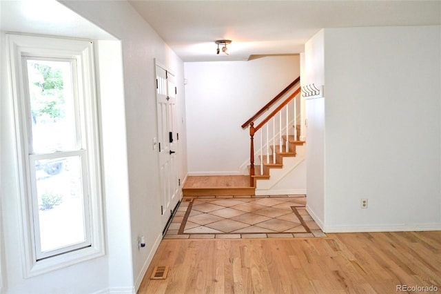 4753 S Gar Way, Littleton, CO 80123 - foyer featuring light wood-style flooring and stairway