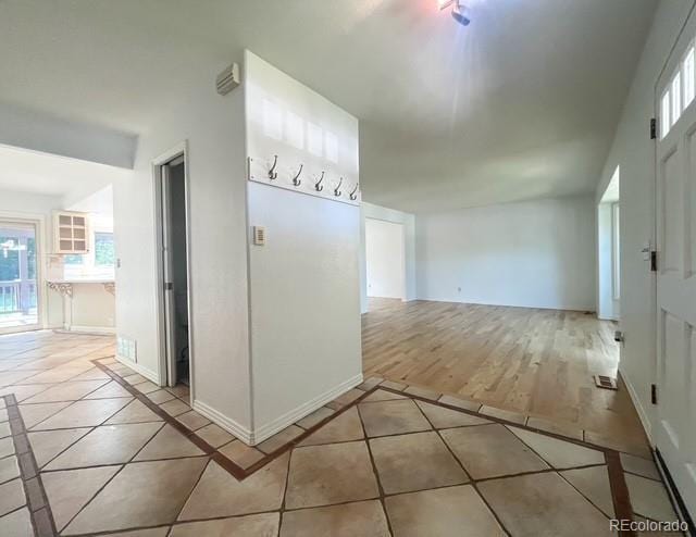 4753 S Gar Way, Littleton, CO 80123 - corridor featuring light tile patterned floors and inlaid floor details