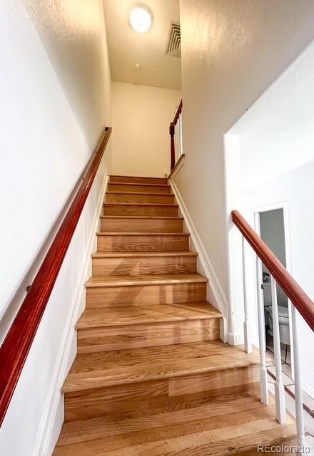 4753 S Gar Way, Littleton, CO 80123 - stairs with wood finished floors