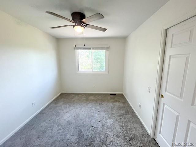 4753 S Gar Way, Littleton, CO 80123 - spare room with a ceiling fan and carpet