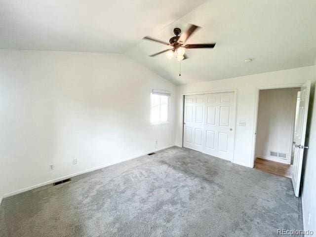 4753 S Gar Way, Littleton, CO 80123 - unfurnished bedroom featuring carpet, lofted ceiling, a closet, and a ceiling fan