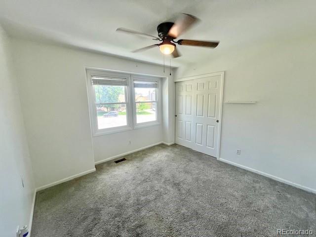 4753 S Gar Way, Littleton, CO 80123 - unfurnished bedroom with carpet flooring, a closet, and a ceiling fan