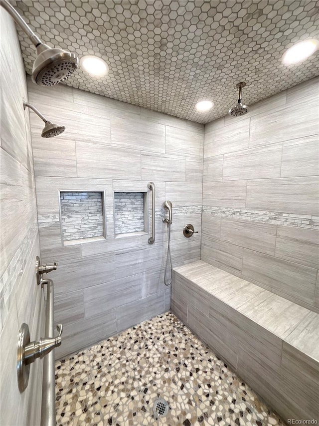 bathroom featuring tiled shower