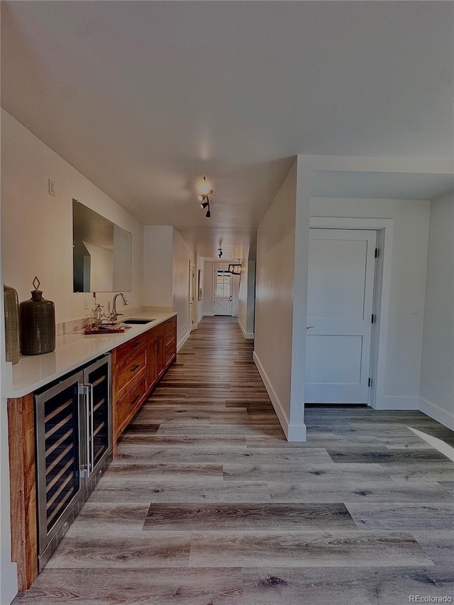 1282 N Crystal Rd, Lake George, CO 80827 - hall with wine cooler, wood finished floors, baseboards, and a sink