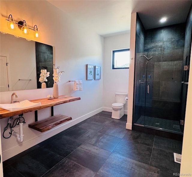 1282 N Crystal Rd, Lake George, CO 80827 - full bath with toilet, a shower stall, baseboards, a sink, and tile patterned floors