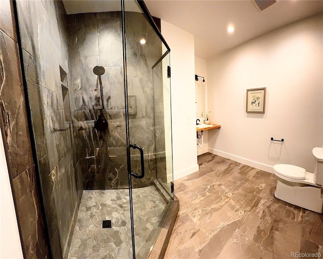 1282 N Crystal Rd, Lake George, CO 80827 - full bath featuring marble finish floors, recessed lighting, a shower stall, baseboards, and toilet