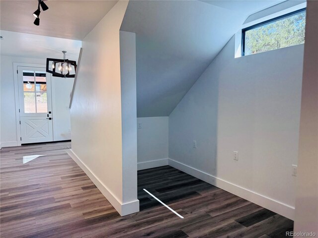 1282 N Crystal Rd, Lake George, CO 80827 - bonus room with vaulted ceiling, a chandelier, healthy amount of natural light, dark wood-type flooring, and baseboards