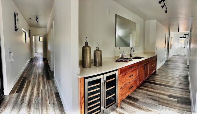 1282 N Crystal Rd, Lake George, CO 80827 - indoor bar featuring beverage cooler, wood finished floors, plenty of natural light, and baseboards