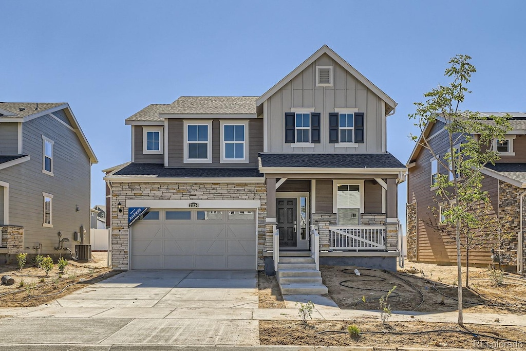 craftsman-style house featuring a garage and covered porch