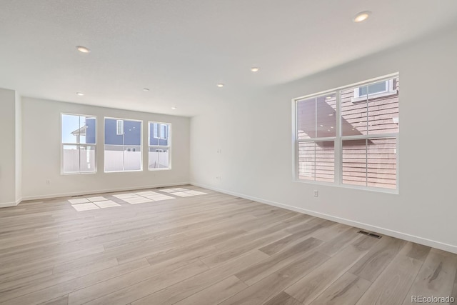 unfurnished room featuring light wood-type flooring