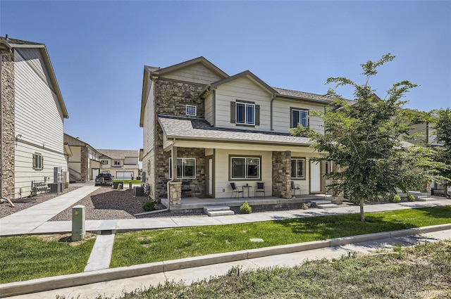 1746 Westward Cir Unit 1, Eaton, CO 80615 - view of front of home featuring stone siding and a porch