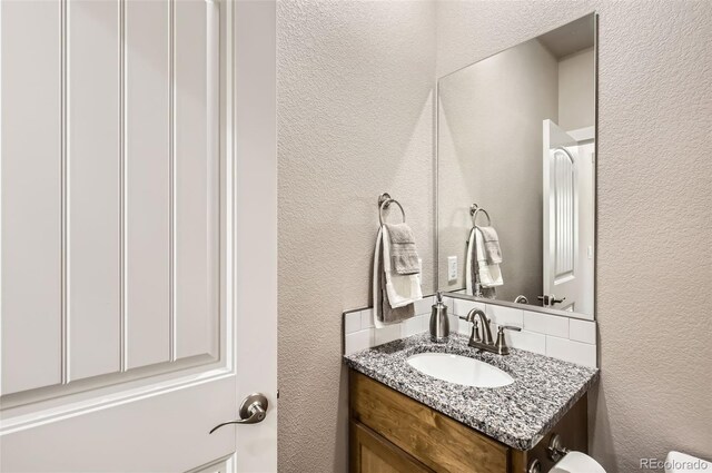 1746 Westward Cir Unit 1, Eaton, CO 80615 - bathroom with a textured wall and vanity