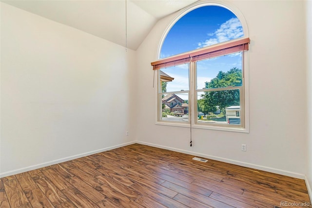 6796 S Newcombe Way, Littleton, CO 80127 - unfurnished room with wood finished floors and lofted ceiling