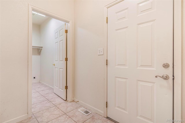 6796 S Newcombe Way, Littleton, CO 80127 - corridor with baseboards and light tile patterned flooring