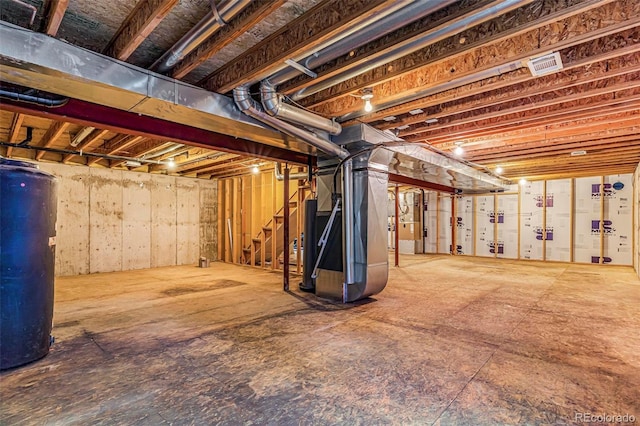 6796 S Newcombe Way, Littleton, CO 80127 - unfinished basement with heating unit, water heater, and stairway