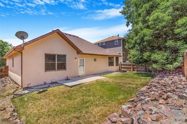6796 S Newcombe Way, Littleton, CO 80127 - rear view of property featuring stucco siding and a patio area