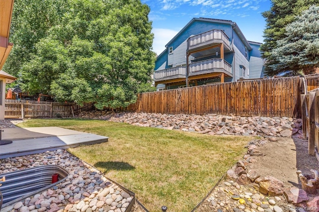 6796 S Newcombe Way, Littleton, CO 80127 - fenced backyard with a balcony and a patio area