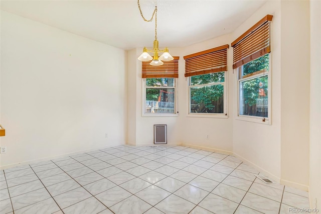 6796 S Newcombe Way, Littleton, CO 80127 - unfurnished room with a chandelier
