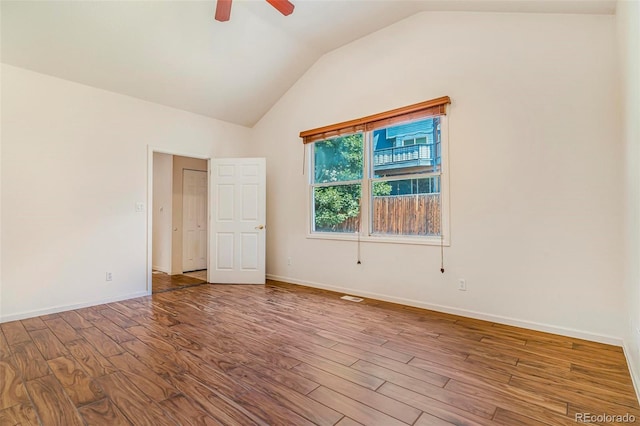 6796 S Newcombe Way, Littleton, CO 80127 - unfurnished room featuring vaulted ceiling, wood finished floors, and a ceiling fan