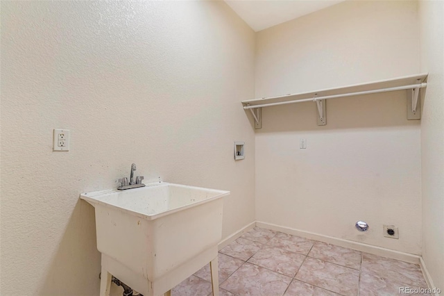 6796 S Newcombe Way, Littleton, CO 80127 - laundry room with hookup for an electric dryer, hookup for a washing machine, and light tile patterned floors