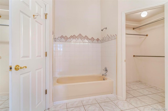 6796 S Newcombe Way, Littleton, CO 80127 - full bathroom featuring tile patterned floors, shower / washtub combination, and a closet