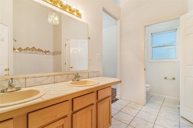 6796 S Newcombe Way, Littleton, CO 80127 - full bathroom with double vanity and tile patterned flooring