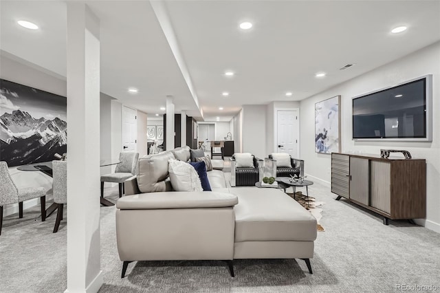living room with light colored carpet and recessed lighting