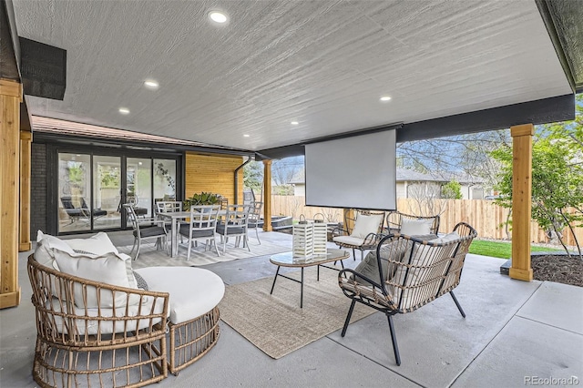 view of patio / terrace with a fenced backyard, outdoor lounge area, and outdoor dining space