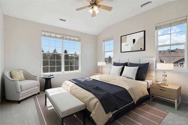 bedroom with carpet floors, vaulted ceiling, ceiling fan, and baseboards