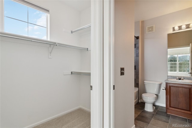 full bathroom with vanity, toilet, baseboards, and bathing tub / shower combination
