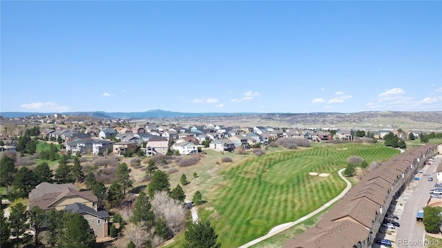 view of property location featuring nearby suburban area and a mountain backdrop