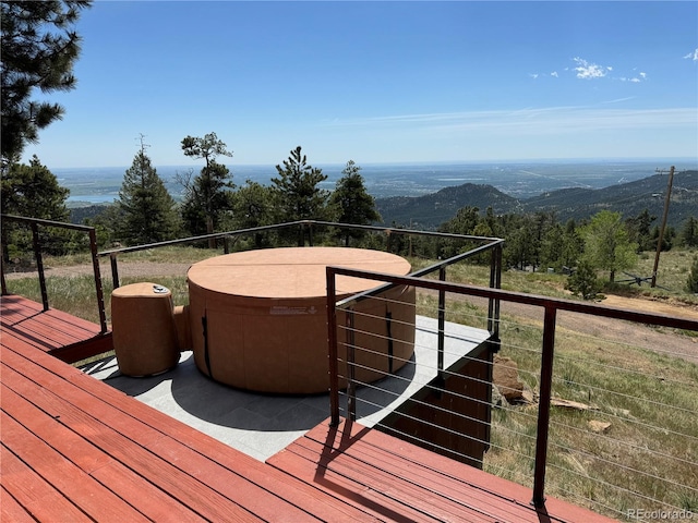 wooden deck with a mountain view