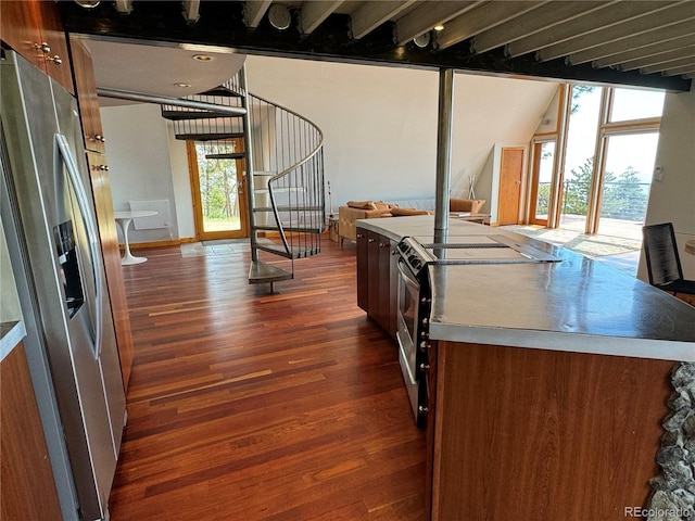 kitchen featuring stainless steel appliances and dark hardwood / wood-style floors